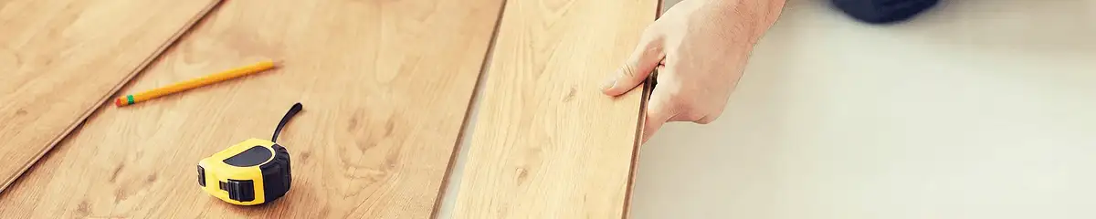 A professional installing wood flooring in South Bend, IN