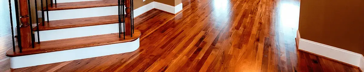 Base floor of a staircase with professionally restored wood flooring in South Bend IN