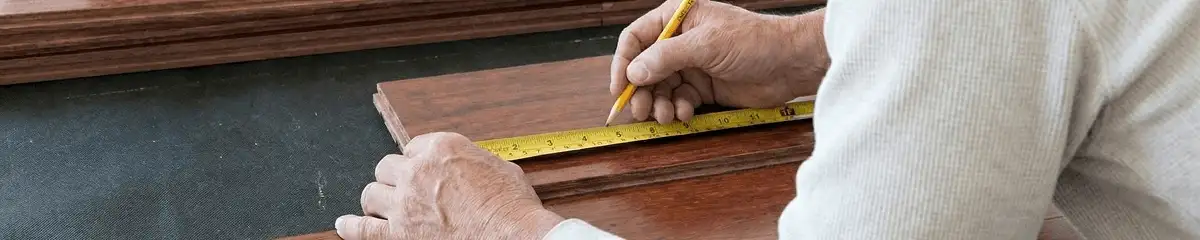 A professional installing wood flooring in South Bend, IN